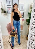 Jeans a vita alta con spacco inferiore