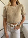 Maglioncino crop beige con piume