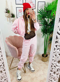 Completo sportivo con righe Rosa