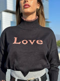Pull nero e rosa