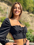 Top nero schiena incrociata