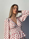 Abito bianco a balze con cuori rossi