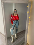 Cardigan rosso con cuori
