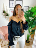 Blusa con catene scollo a barchetta