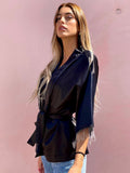Blusa o kimono con frange