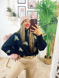 Maglione collo alto con rose nero