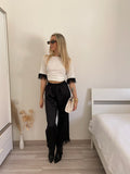 Pantalone nero con piume
