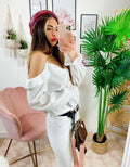 Blusa con catene scollo a barchetta