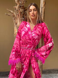 Abito con maxi spacco Fuxia con piume