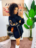 Abito in maglia con fiocchetti e paillettes