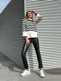 Maglione a righe collo alto