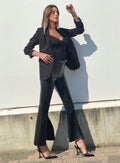 Pantalone in ecopelle con spacco
