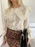 Camicia in pizzo beige con ricami
