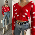 Cardigan rosso con cuori