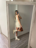 Tutina beige con catenina oro