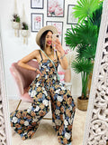 Tuta floreale con pantalone a pieghine