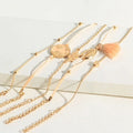 Bracciale con mondo e nappina rosa