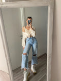 jeans con dettaglio aperture e catene