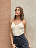 Top a costine beige spalline oro