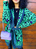 Cardigan verde con frange e cinta