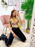 Top floreale con cintura