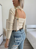 Maglia crema con apertura