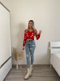 Cardigan rosso con cuori