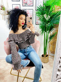 Blusa con rouge e fiorellini