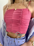Top drappeggiato con fiocchetti rosa