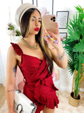 Abito corto bordeaux con gonna incrociata
