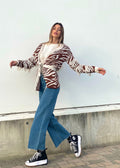 Cardigan zebrato beige con frange e cinta