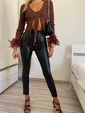 Pantalone in ecopelle con strass
