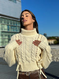 Maglione panna con trecce