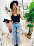 Jeans boyfriend zampa larga con maxi spacchi