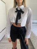 Gonna con rosa e camicia