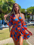Abito arancio fiori azzurri