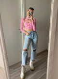 jeans con dettaglio aperture e catene