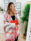 Cardigan A rombi bianco con frange e cinta