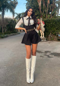 Salopette nera più camicia fiocchetto