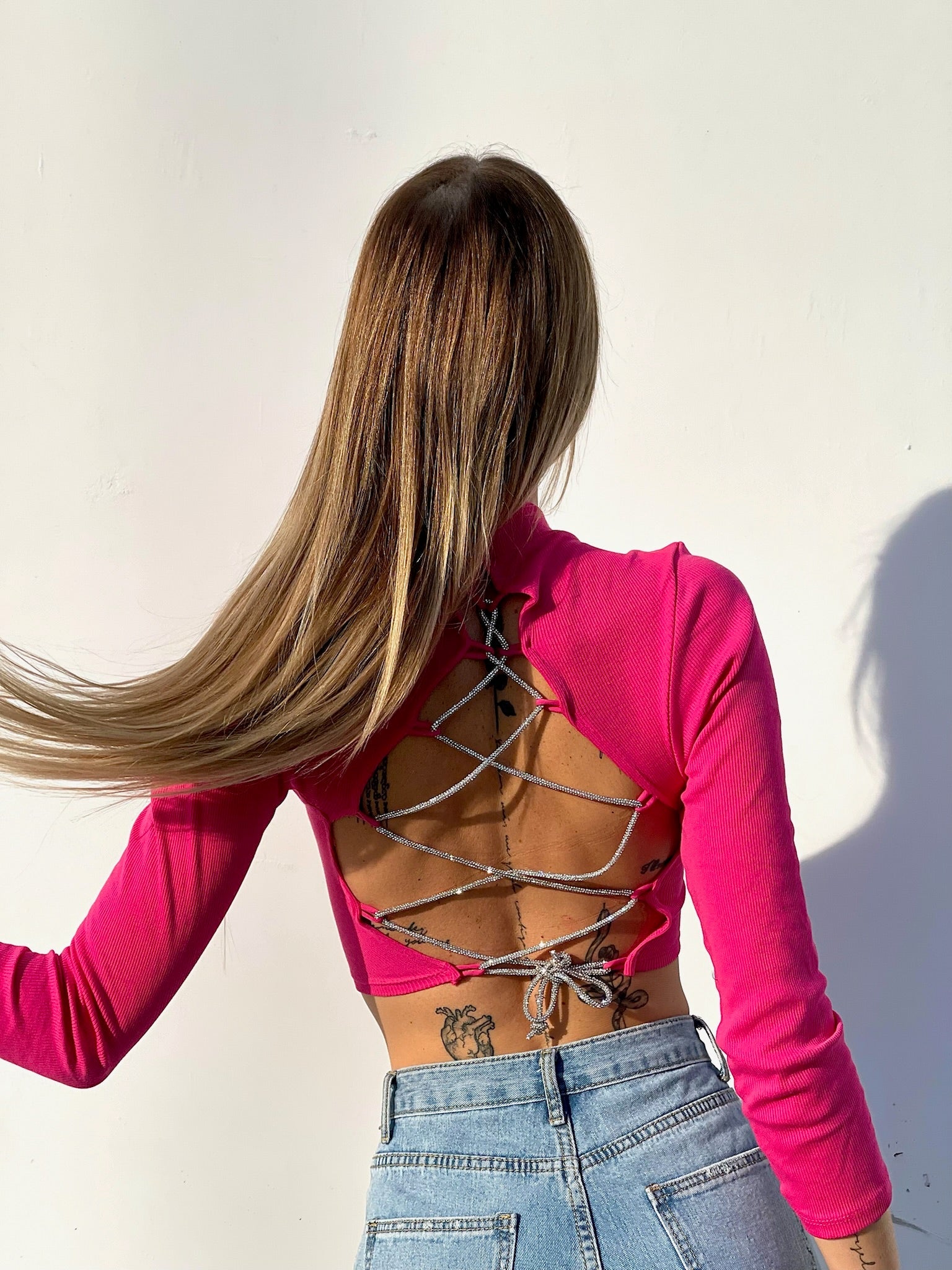 Maglioncino con lacci in strass Fuxia