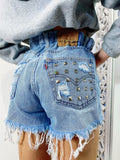 Short Levi’s Vintage bagno chiaro con borchie