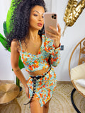 Completo top e gonna con fiori arancio base verdeacqua