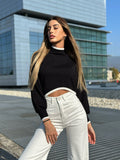 Pull nero rigo bianco