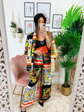 Pantalone a zampa stampa etnica Base Arancio
