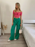 Top rosa barbie scollo a barchetta e fiocco