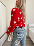 Cardigan rosso con cuori