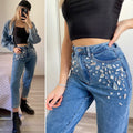 Jeans con pietre in strass