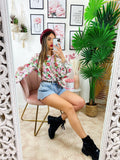 Camicia floreale con borsetta