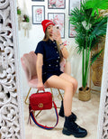 Tutina in jeans nera con tasche