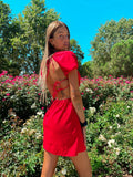 Abito rosso schiena incrociata